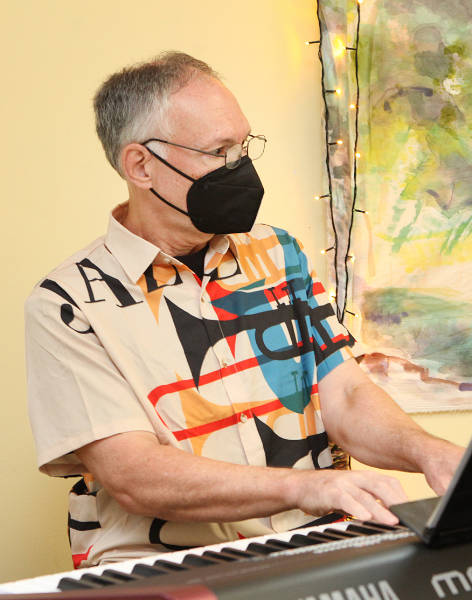 Todd Beaney playing an electric keyboard